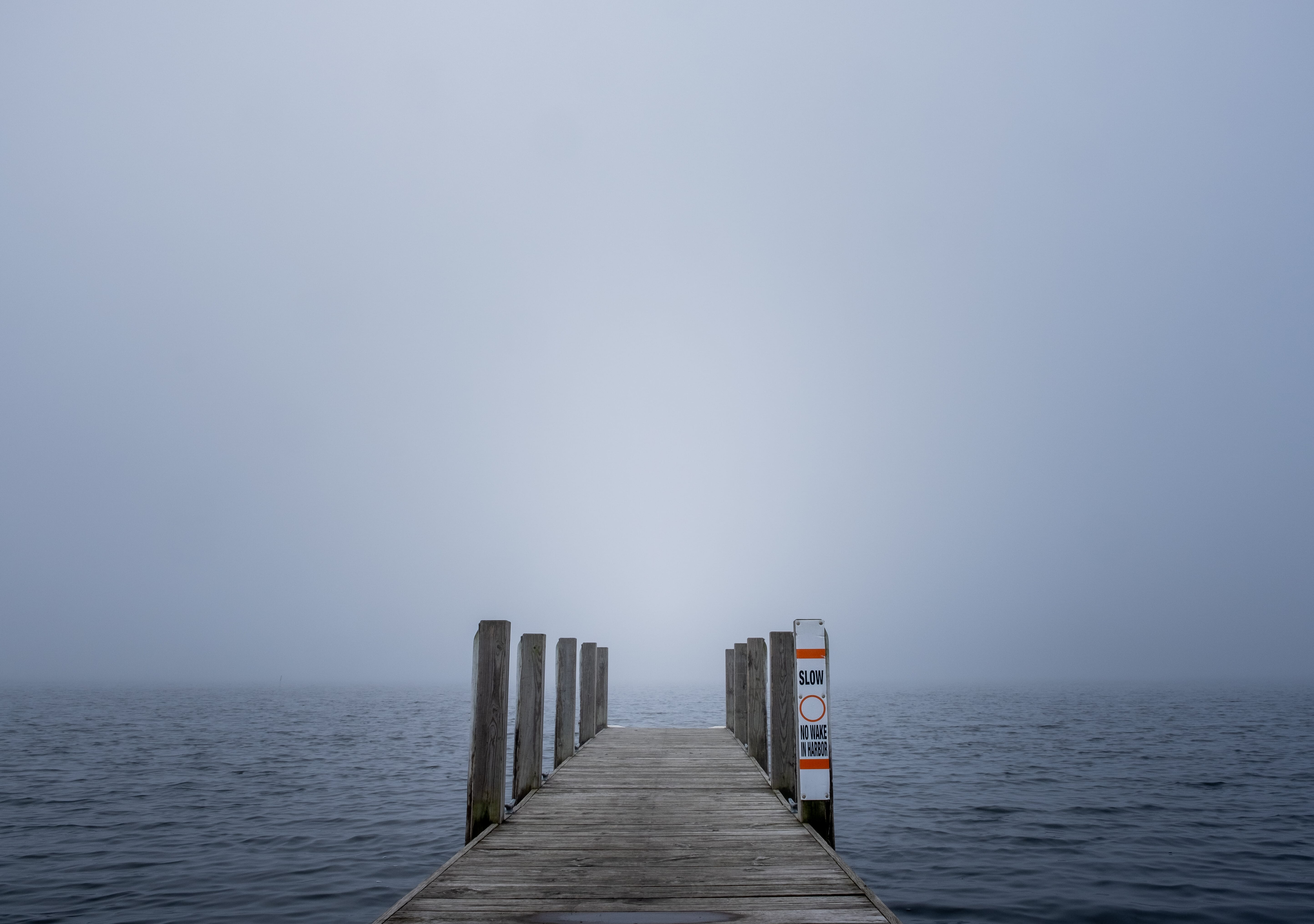 dock stretching off into fog