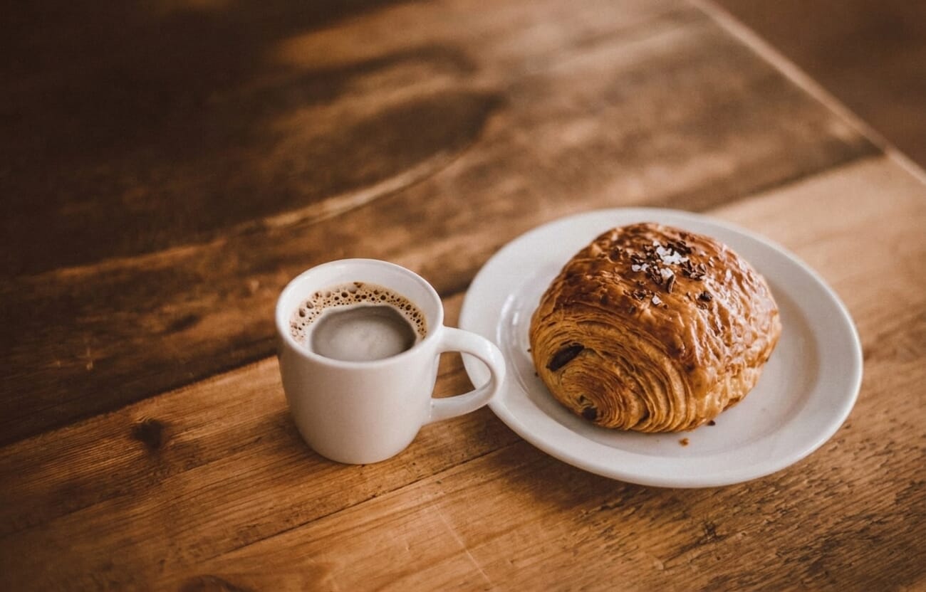 Coffee and croissant, Gemini output with flaky pastry detail