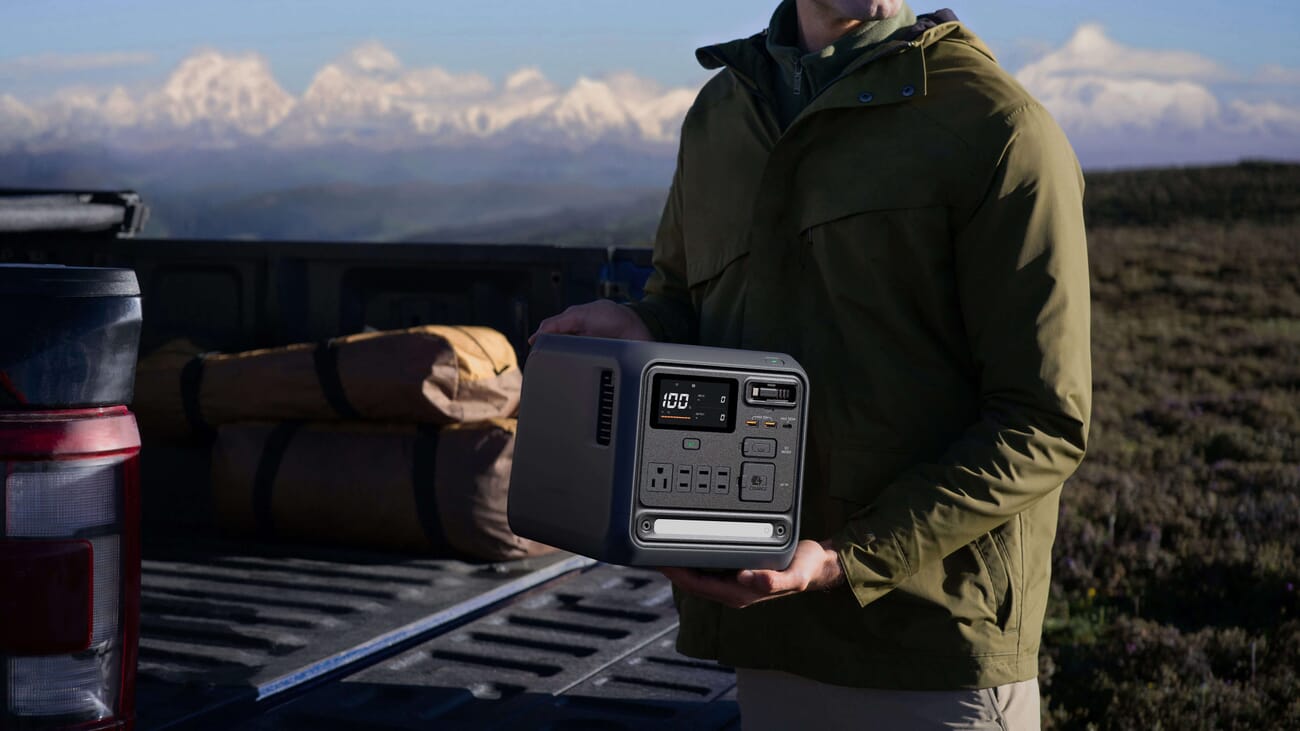 DJI Power 1000 Mini carried at an outdoor location shoot — the 11.5kg weight means it travels without two people