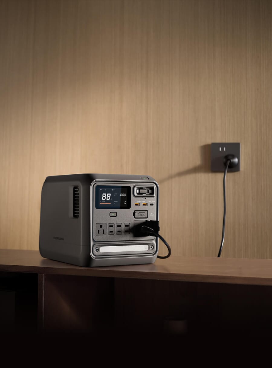 DJI Power 1000 Mini front view showing the retractable 100W USB-C cable wrapped around the unit