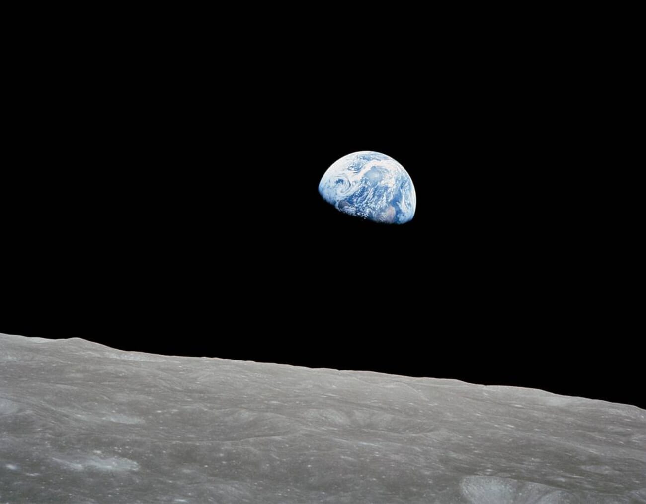 Earthrise — the iconic 1968 photograph of Earth rising above the lunar horizon, taken by Apollo 8 astronaut Bill Anders