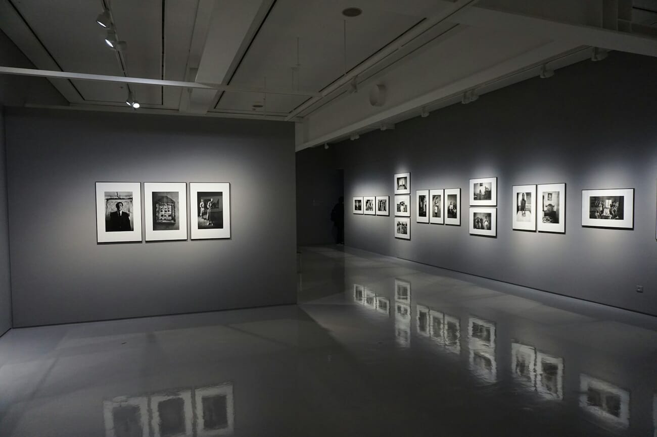 Framed photographic prints displayed on a gallery wall