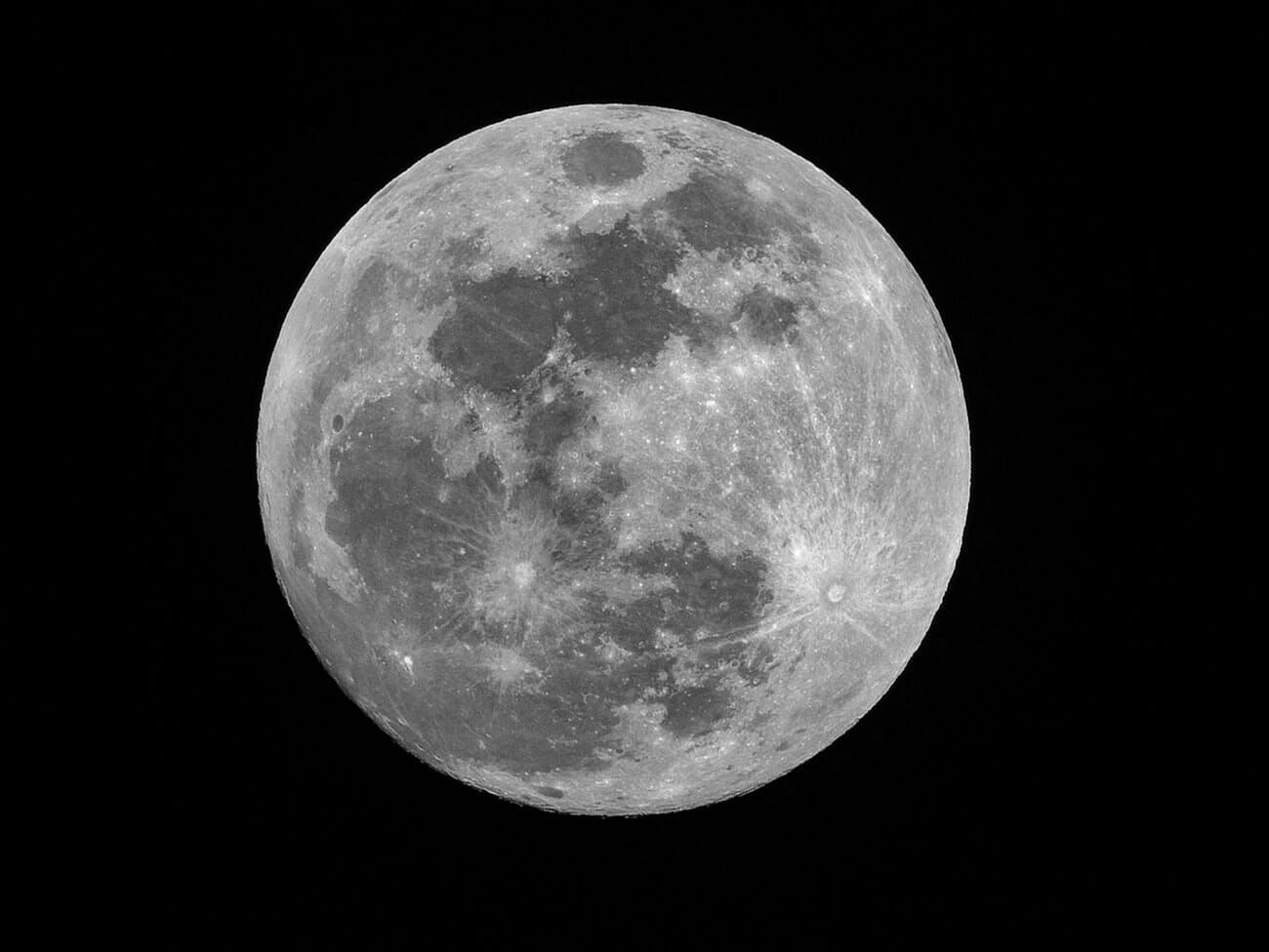 A full moon photographed with a long telephoto lens