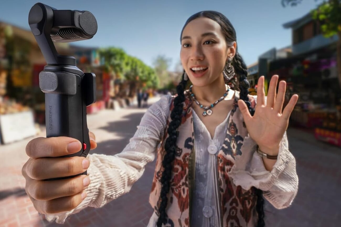 A creator holds the Insta360 Luna Ultra dual-lens Leica gimbal camera on a market street