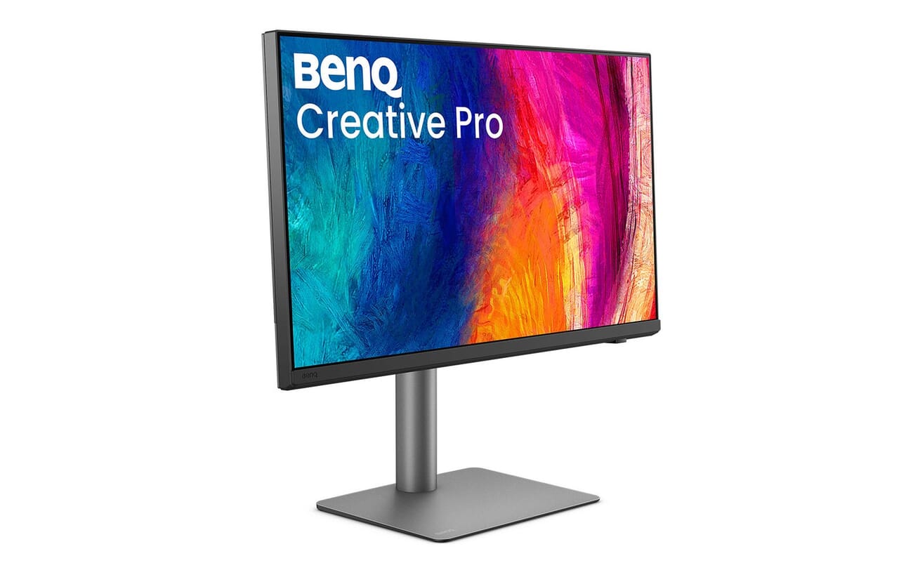 BenQ Creative Pro PD2732U 27-inch 4K monitor at a three-quarter angle showing the vibrant on-screen artwork used by BenQ in press imagery
