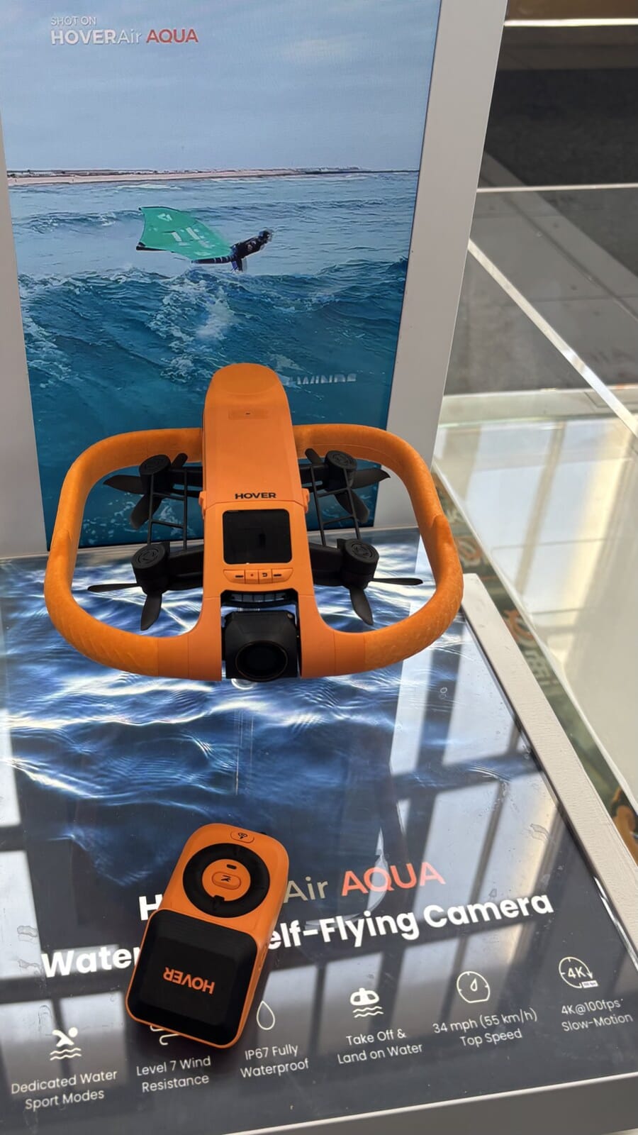 HoverAir Aqua drone and controller at IFA 2026 with a banner listing waterproof, 4K 100fps and water-sport specs