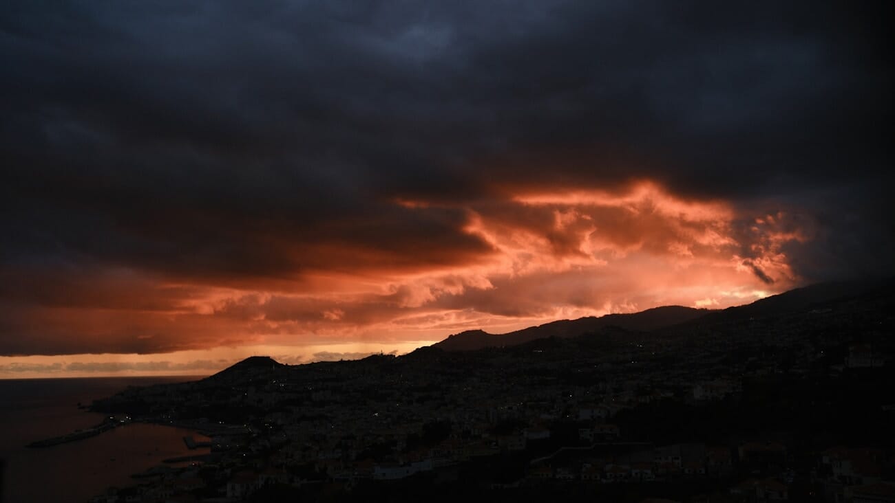 Dramatic stormy coastal sunset with fiery red sky captured on the Fujifilm X-S20 at 23mm