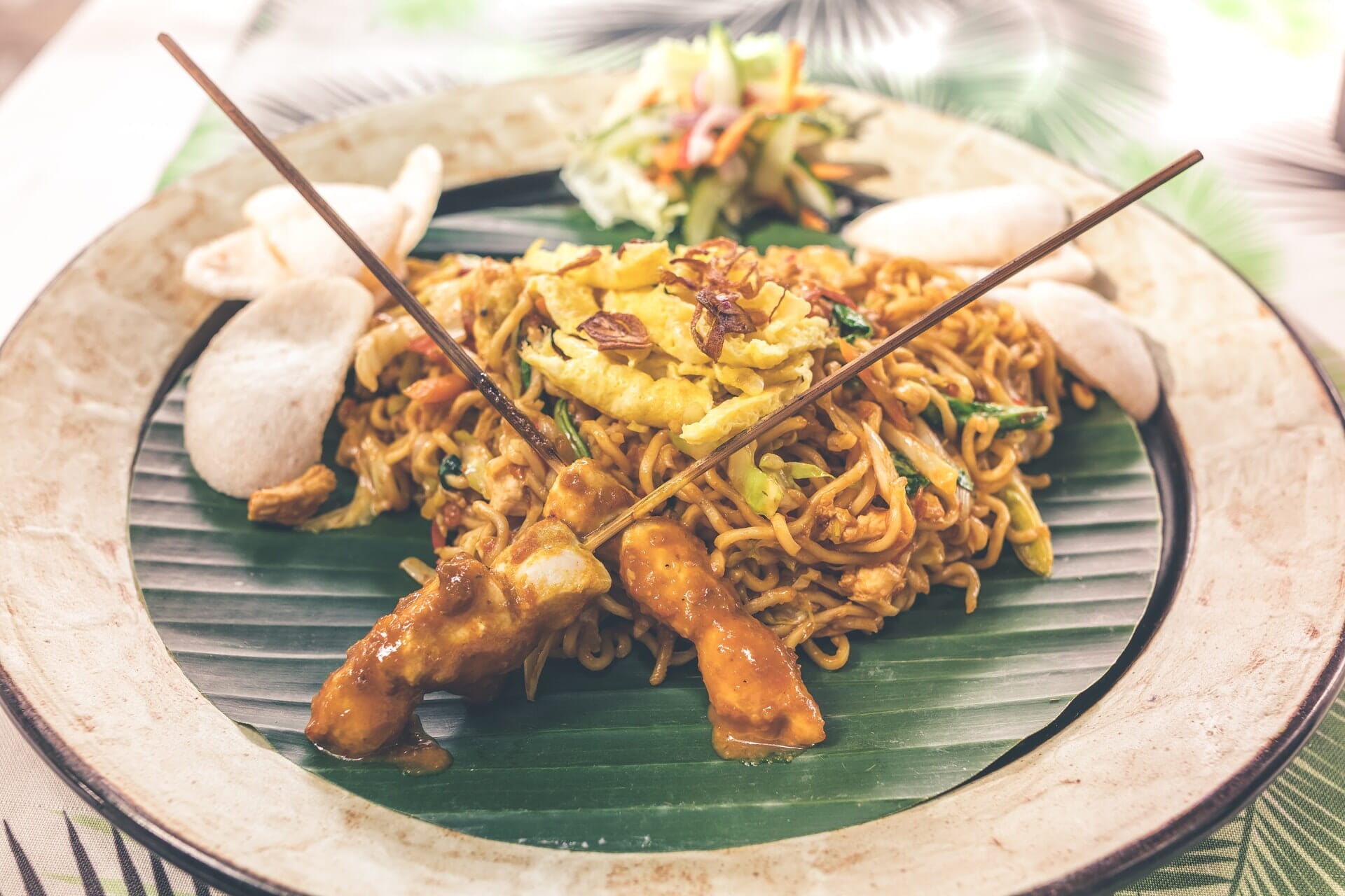 A Balinese noodle stir fry with satay skewers