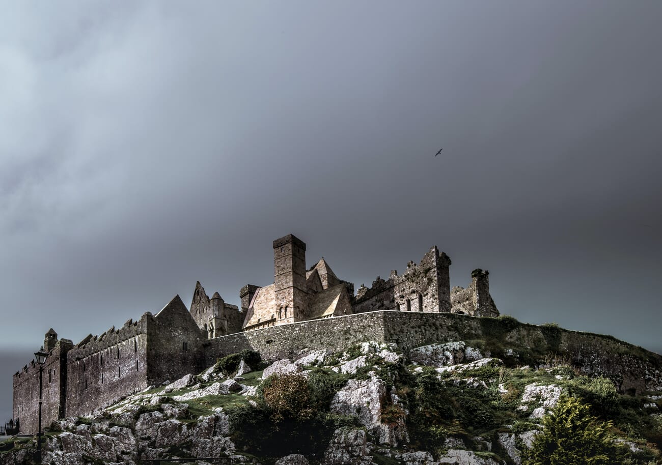 Moody castle under overcast sky with atmospheric mood