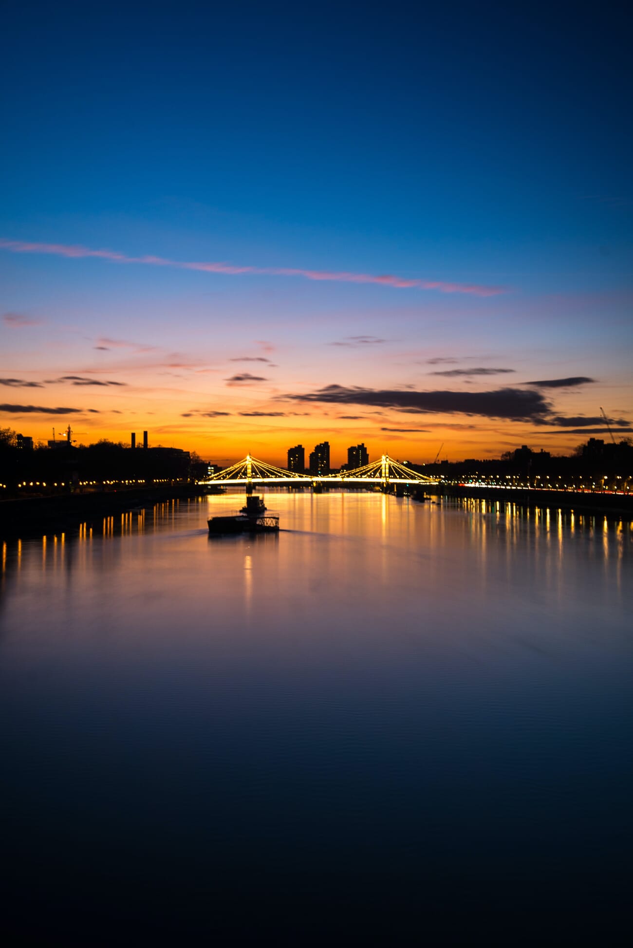 Blue hour fishing boat on calm water
