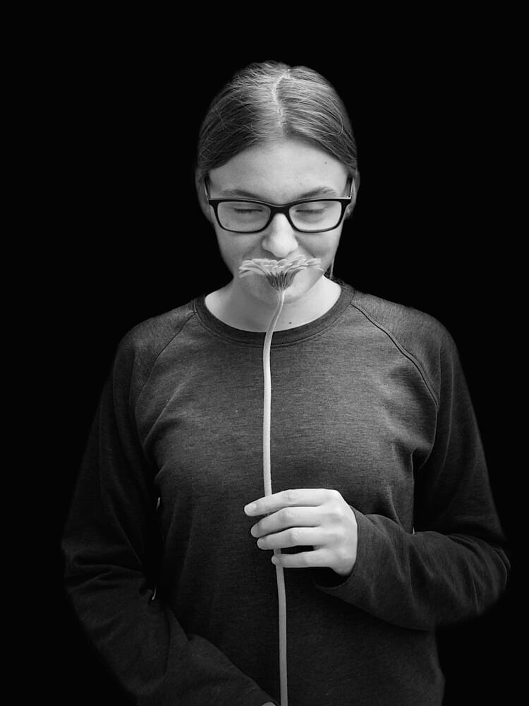 Portrait with black background.
