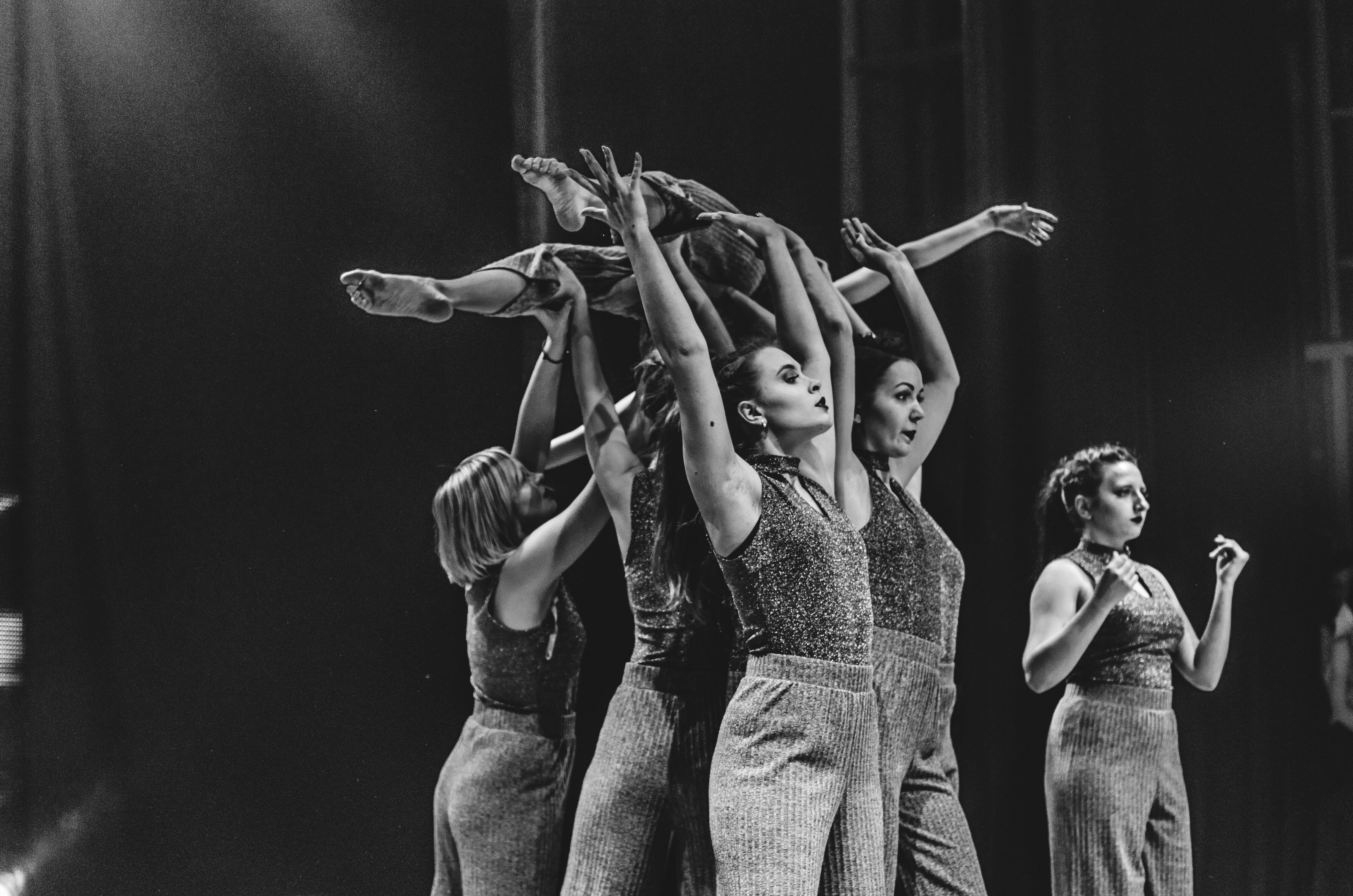 stage performers carrying a person
