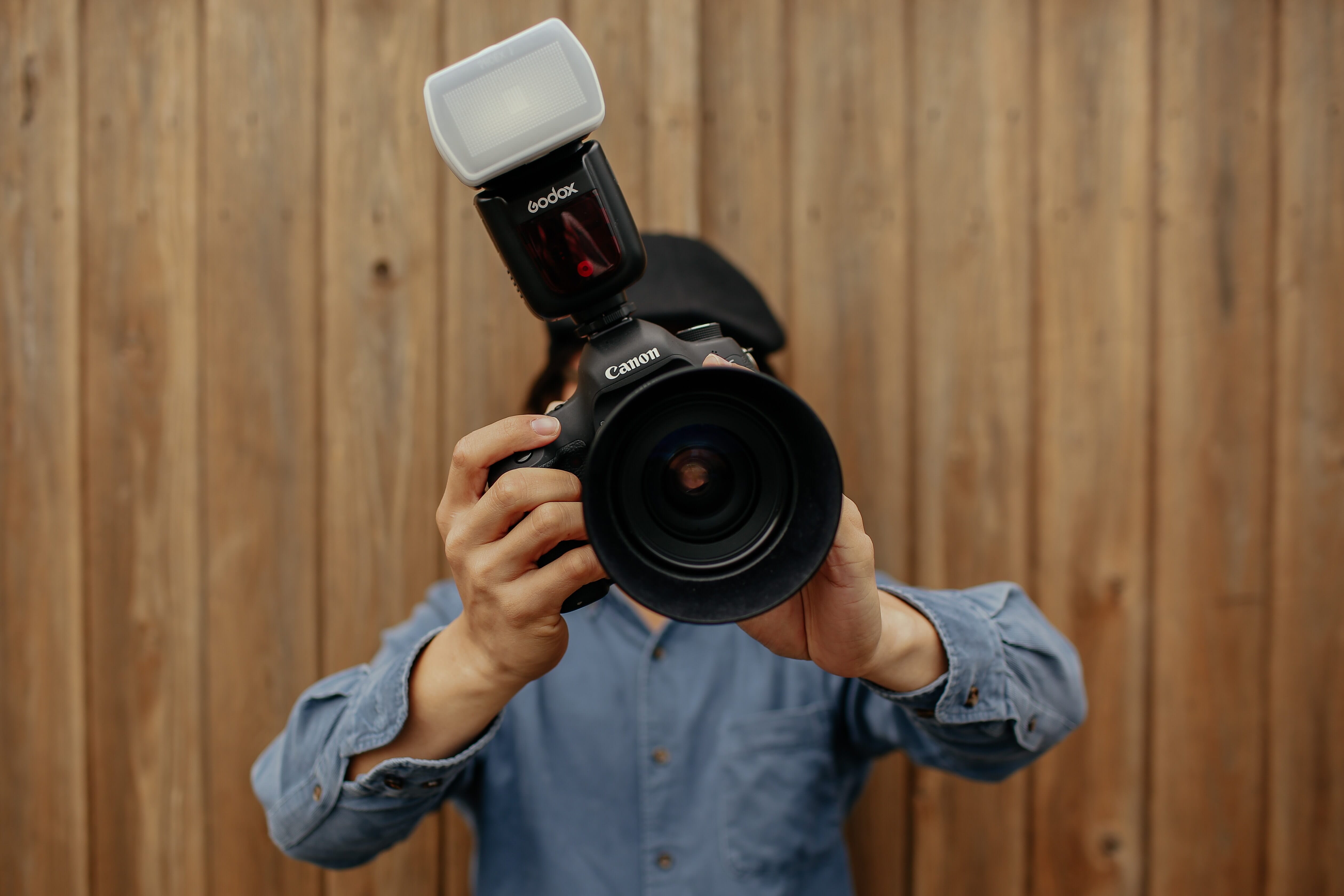 photographer with a camera and flash