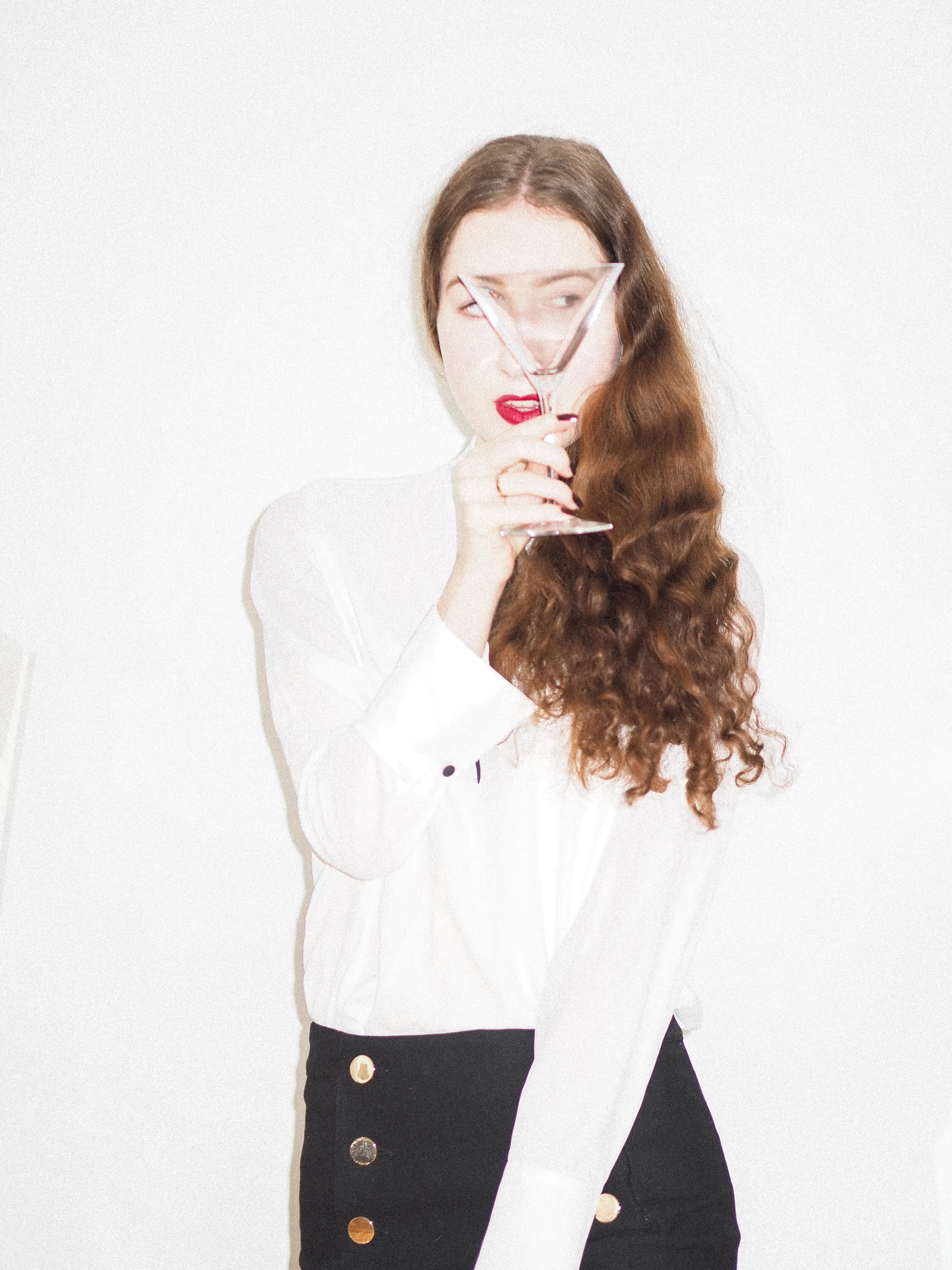Direct flash portrait of woman with wine glass