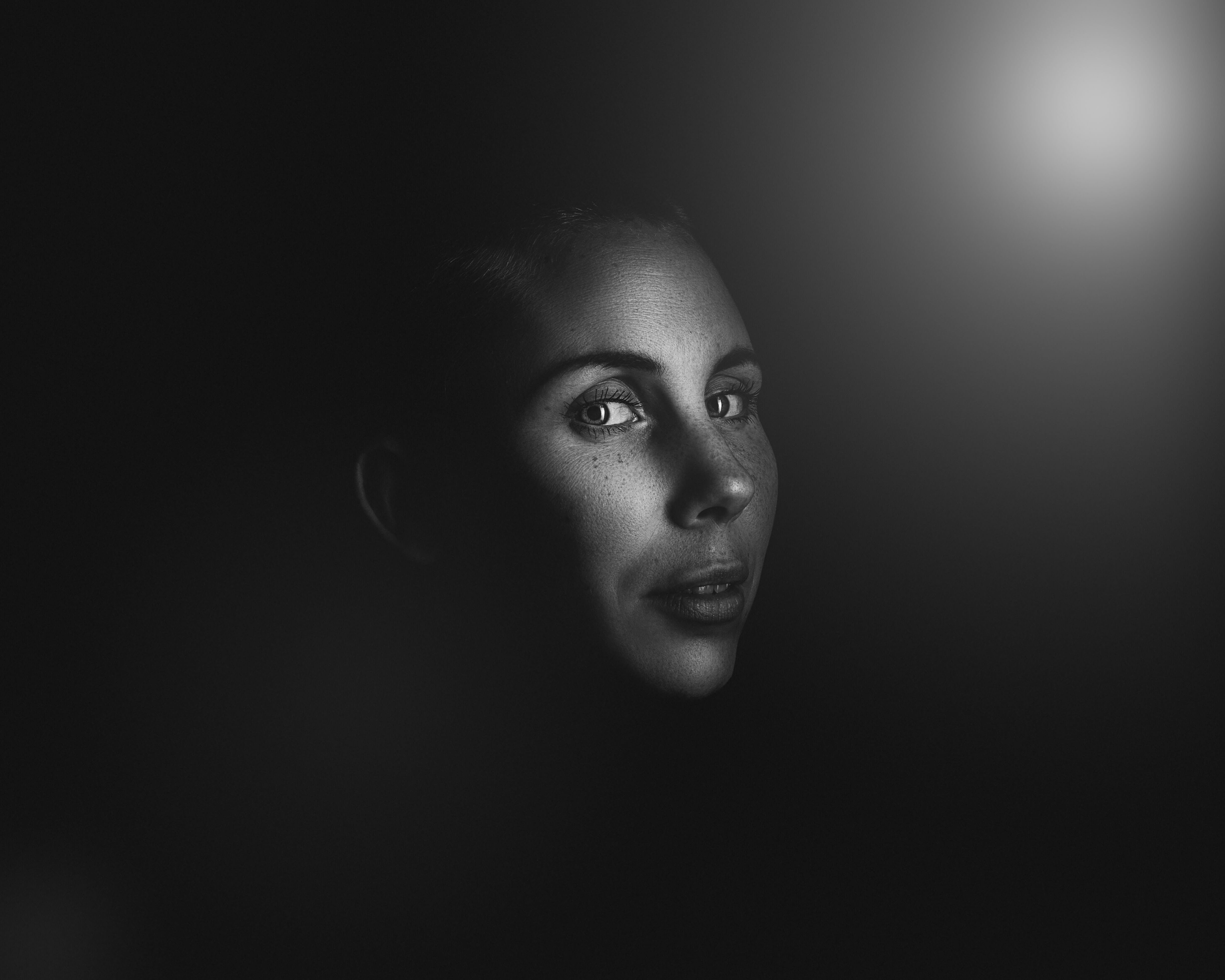woman lit by multiple flashes