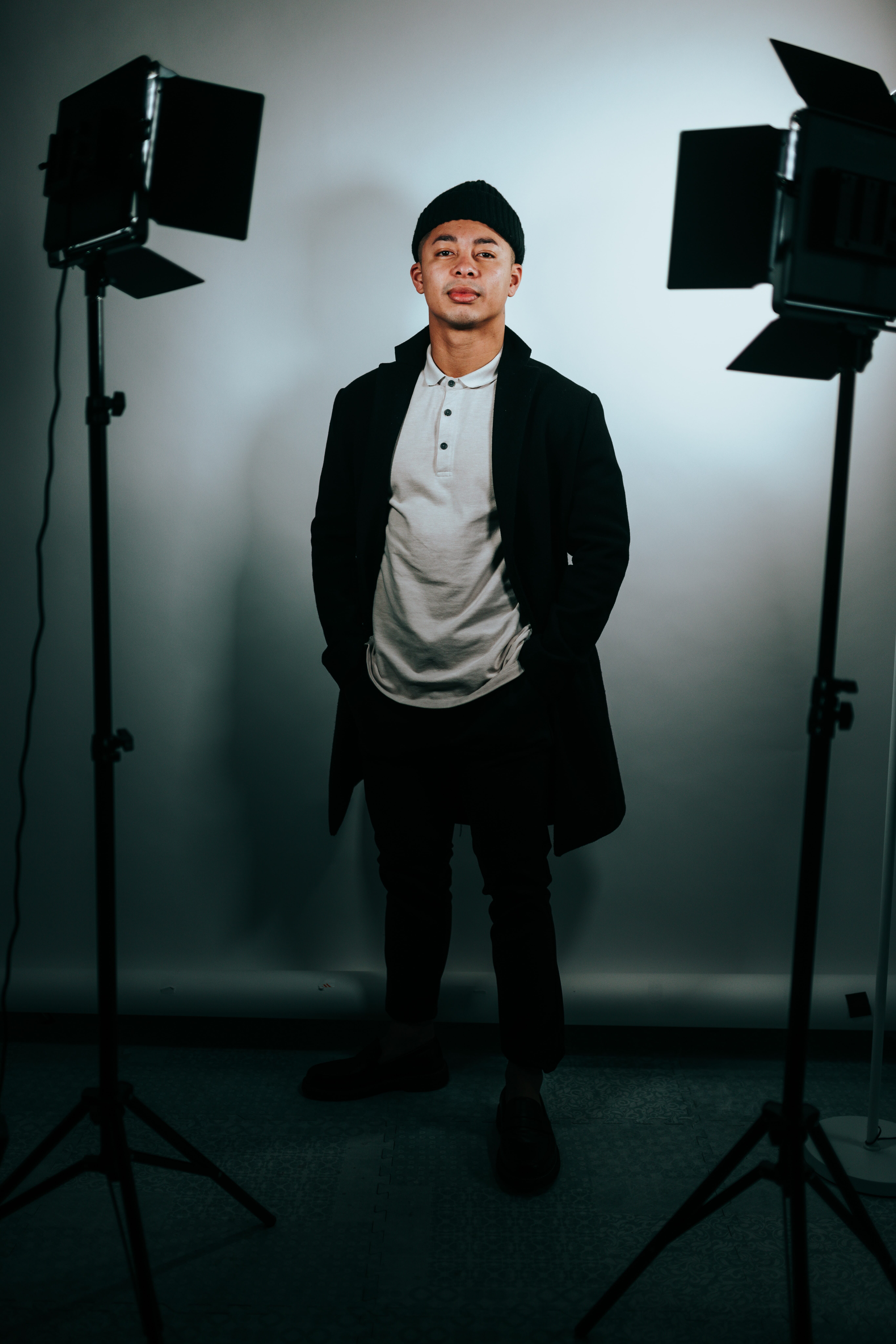 man posing in front of external lights