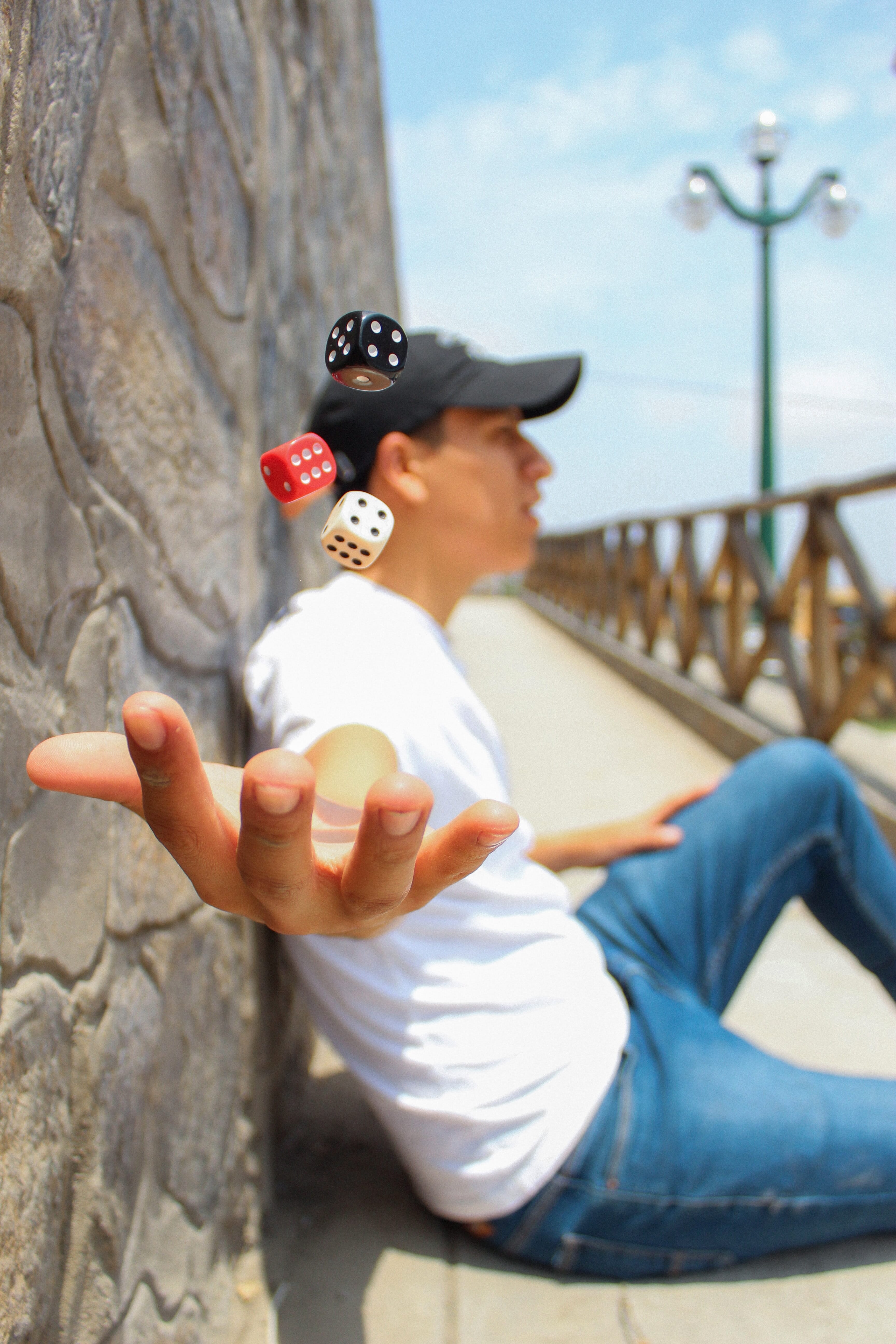 Likewise, throwing dice into the air isn't exactly surreal. However, with levitation techniques, the photographer can capture the perfect composition in one or two shots rather than after a thousand tries