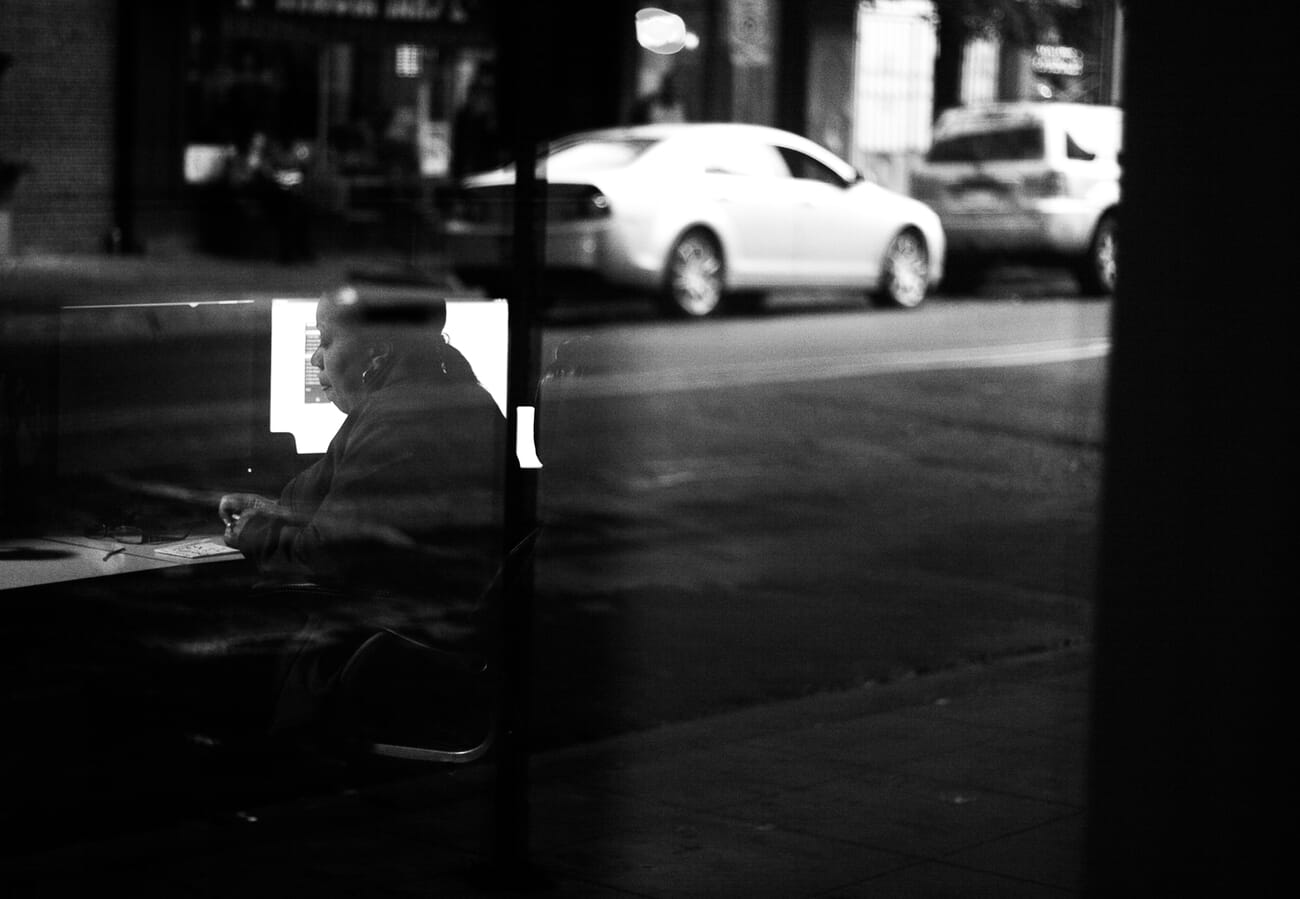 Photographer stabilizing body for low light shooting