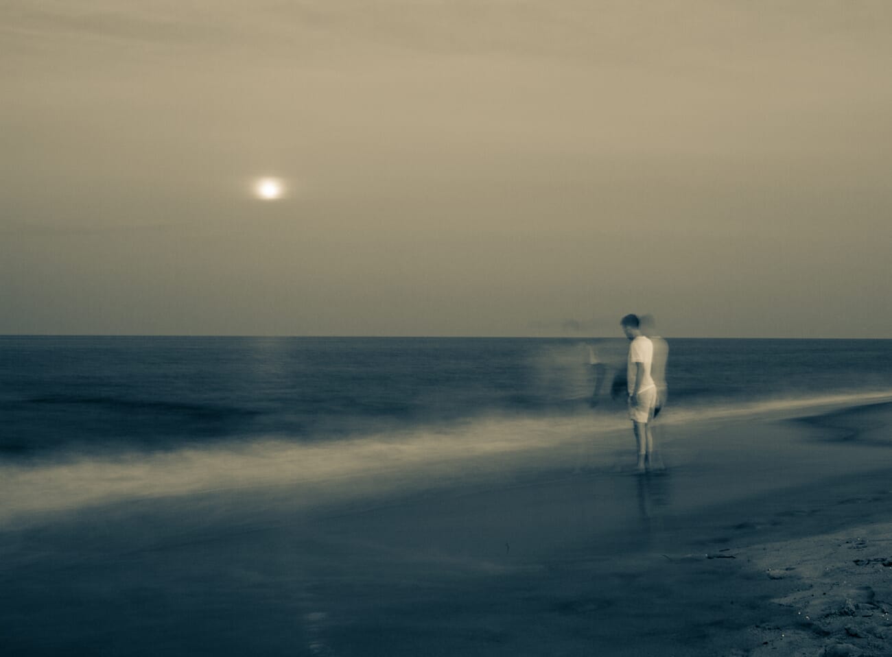 Motion blur example showing ghostlike figures walking in low light