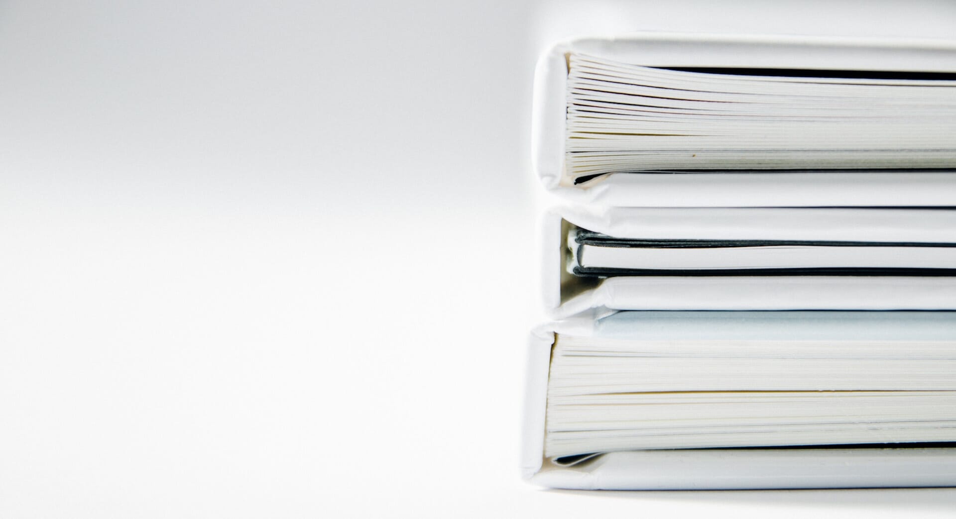 A simple organization system, like using binders, can help manage important documents.