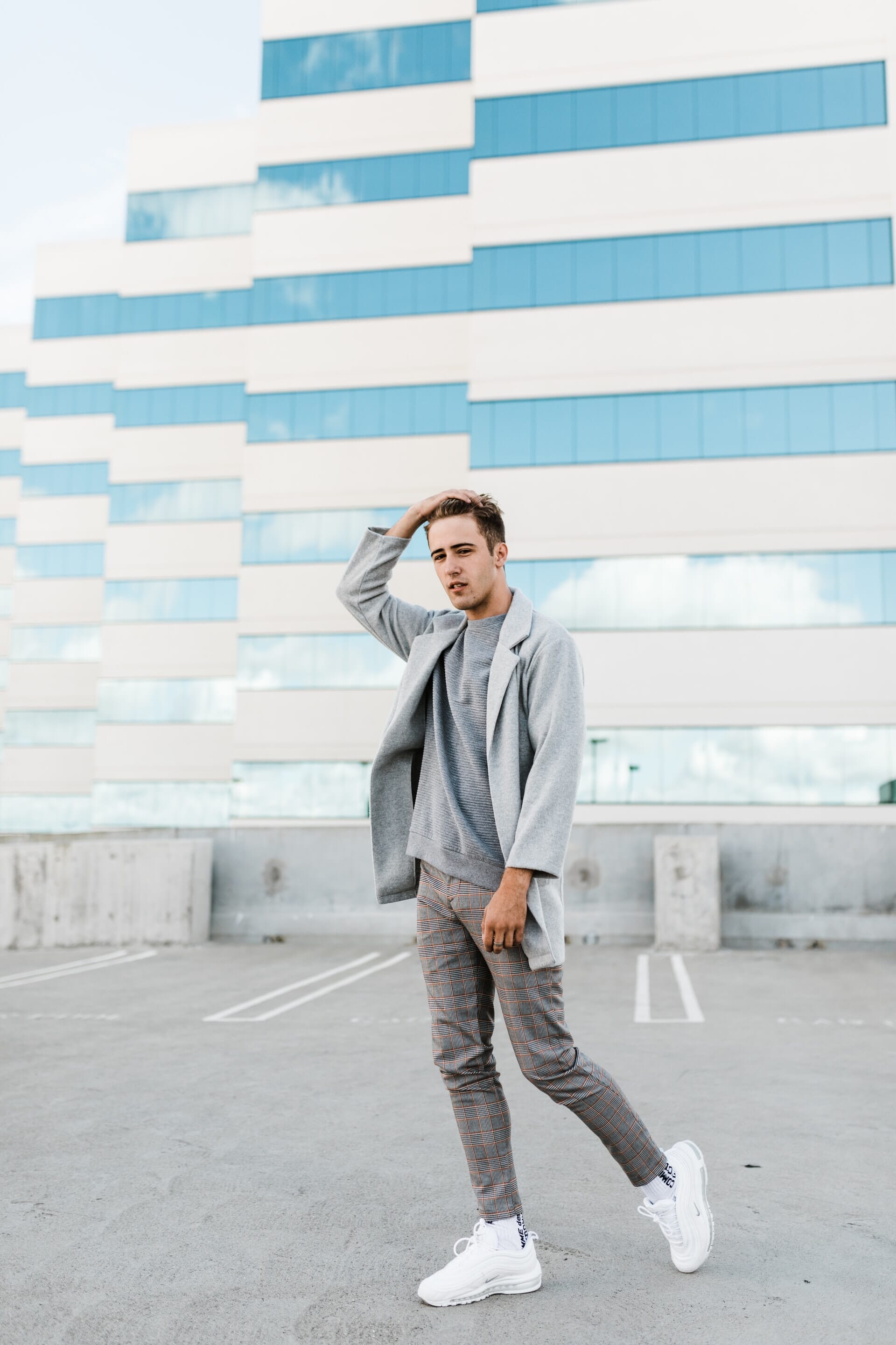 Capture your model against patterns, leading lines, or repetition for creative rooftop photoshoot ideas