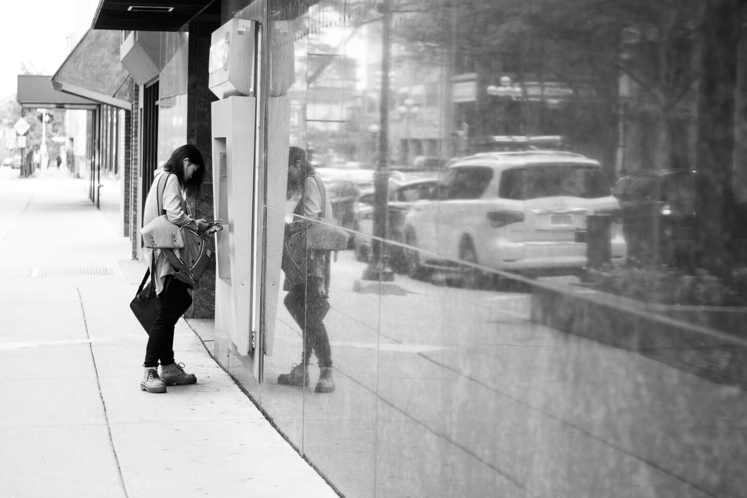 Woman enters building street photo