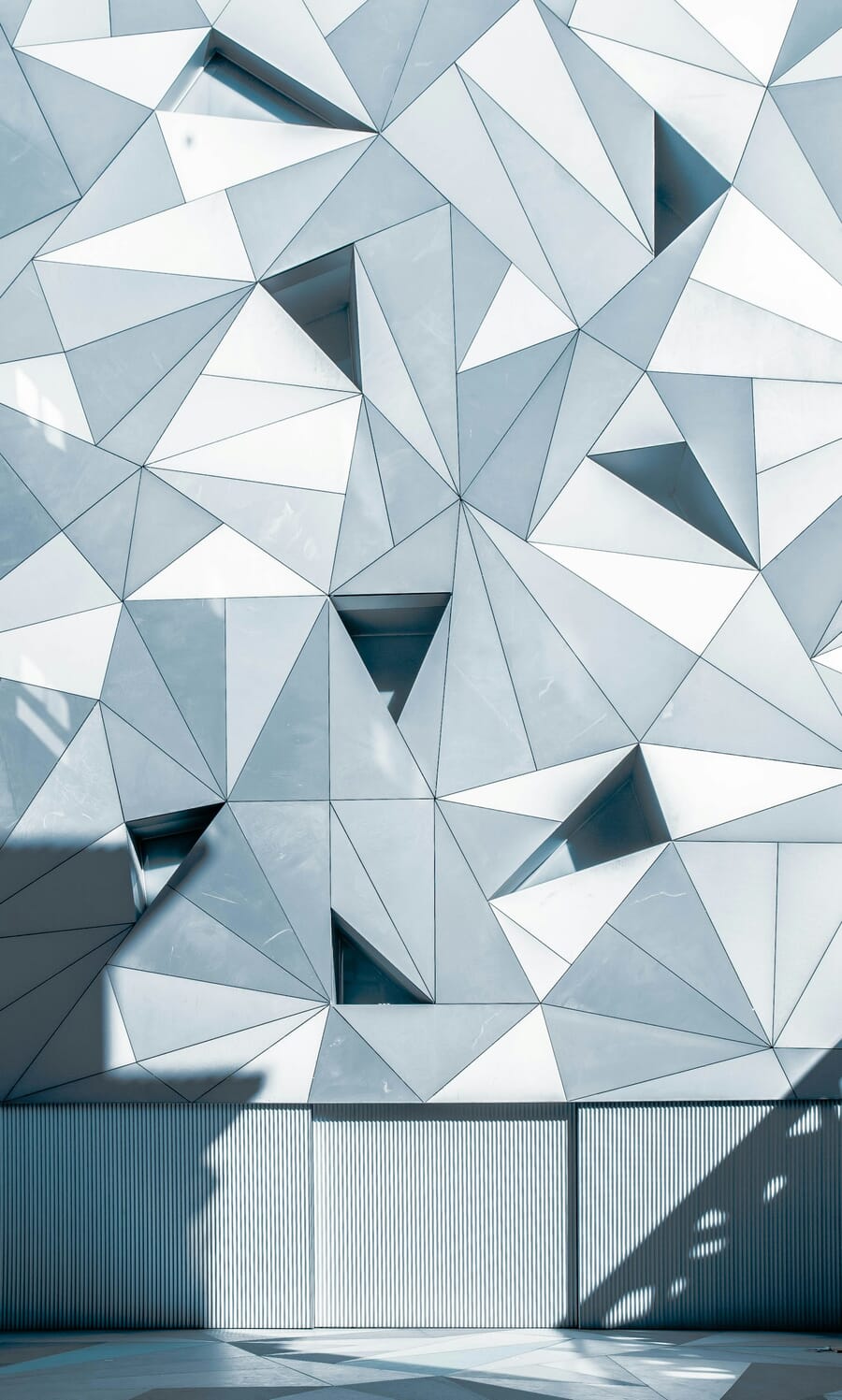Geometric triangular building facade in sharp detail, shot at f/11
