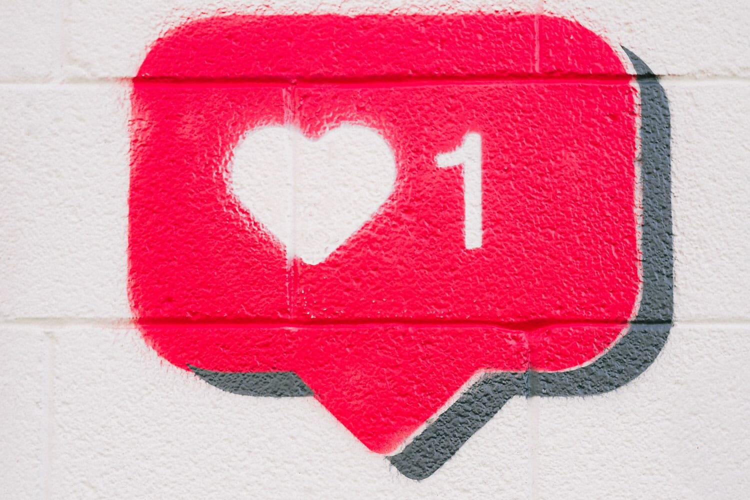 Instagram 'Like' icon spray painted on a wall