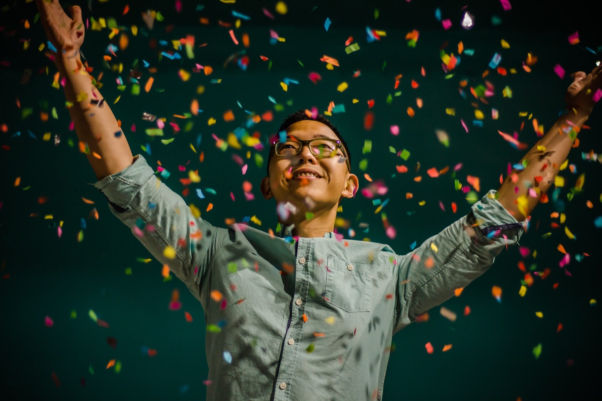 man throwing confetti
