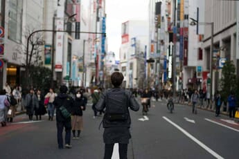person with camera bag