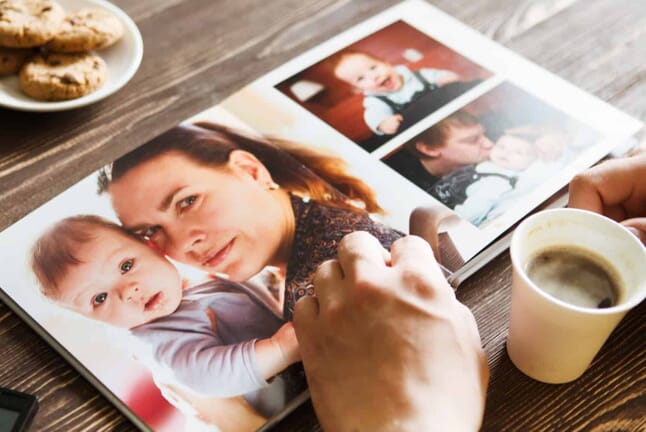 Photo Book on table open with photos showing.