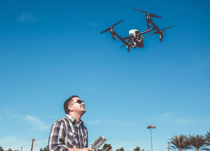 Man Flying a Drone