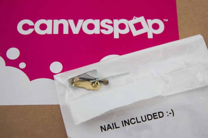 CanvasPop Ships their Canvas with Nails. That's pretty cool indeed.