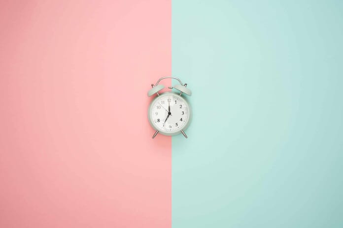 clock on colors flat lay