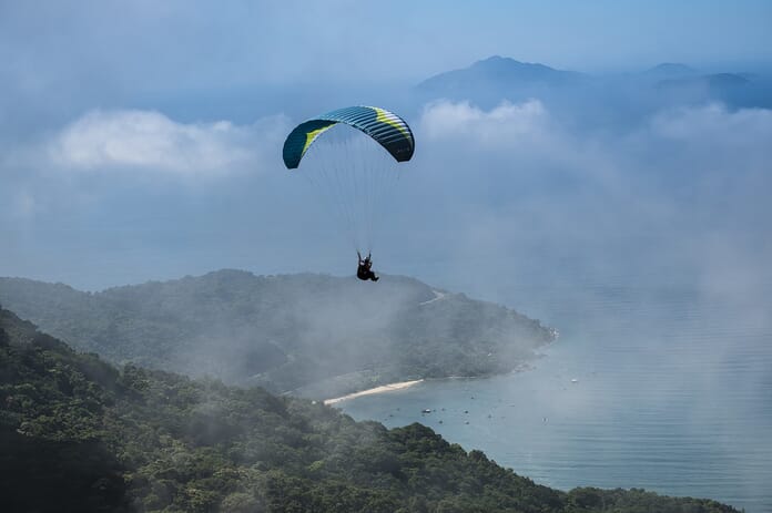 Photograph showing person gliding to the ground from a Skydive