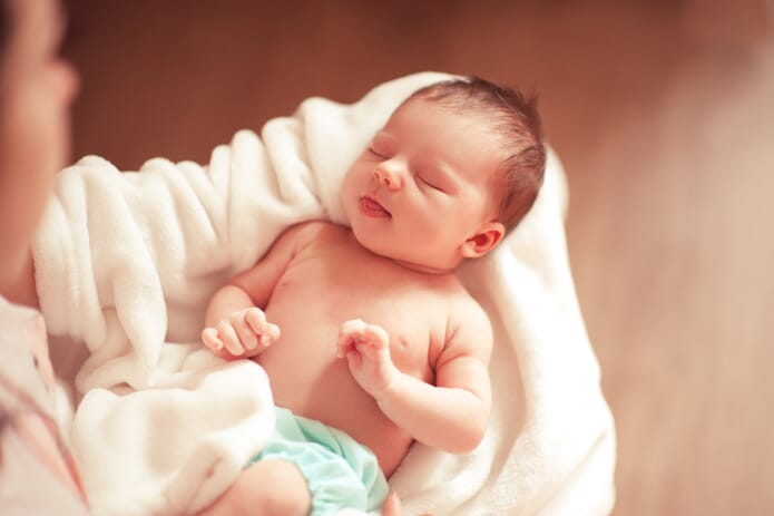 baby sleeping in blanket