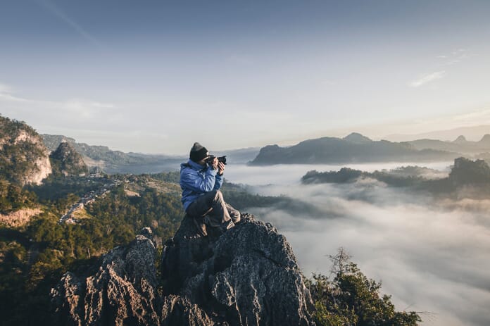 photographer taking landscape photo