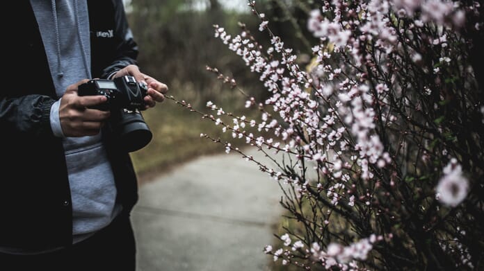 photographer with DSLR
