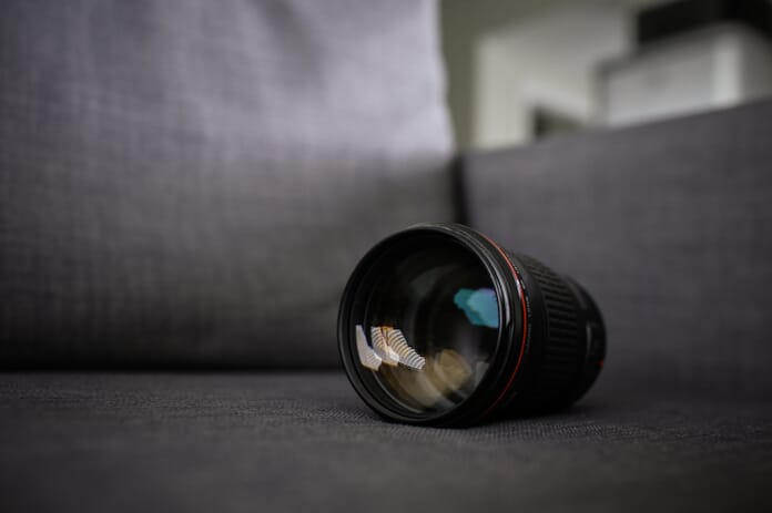 lens on couch photography gear
