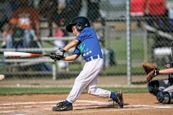kid playing baseball best camera for sports photography