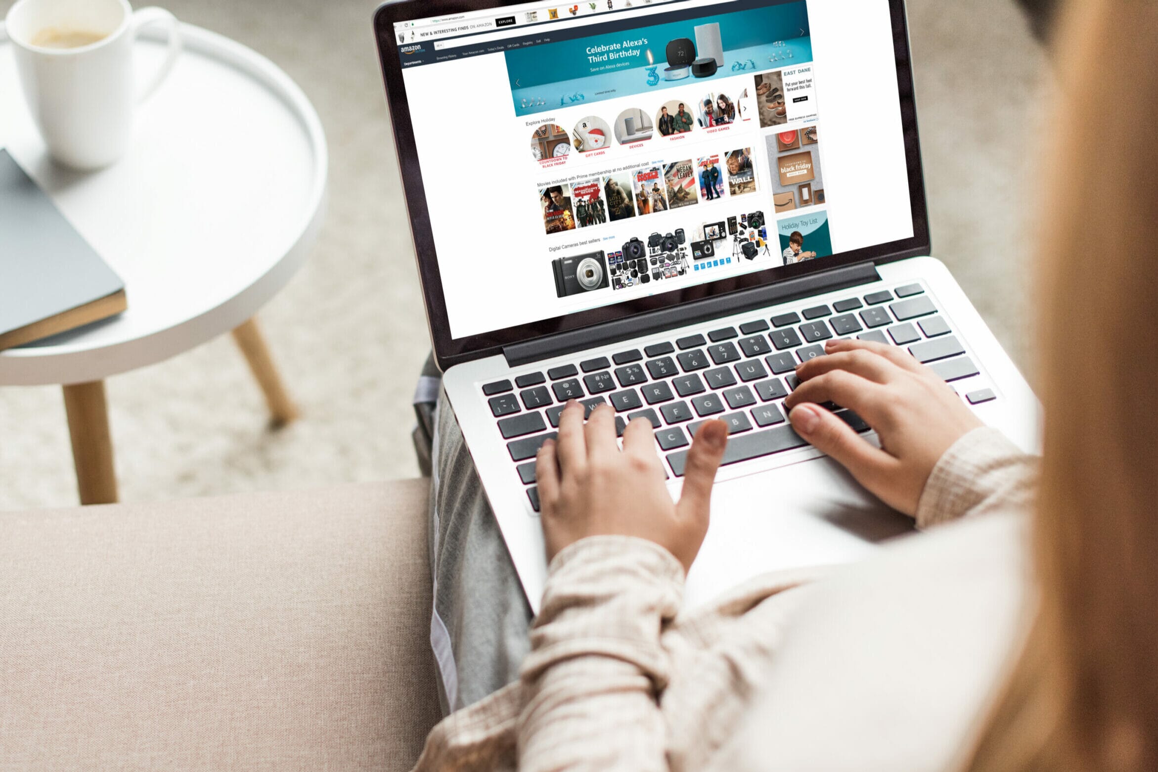 Person browsing Amazon on a laptop