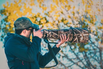 nikon telephoto lenses man with super-telephoto setup