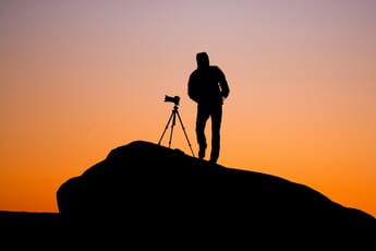 Traveling Photographer with Tripod