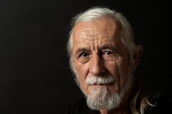 Portrait of man using artificial light in a studio.