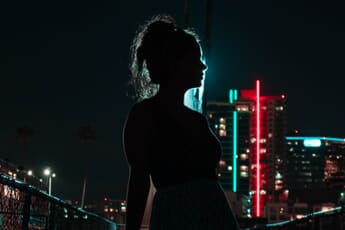 Rim light of a woman at night.