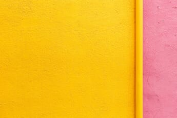 Yellow and light pink colored wall.
