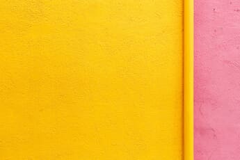Yellow and light pink colored wall.