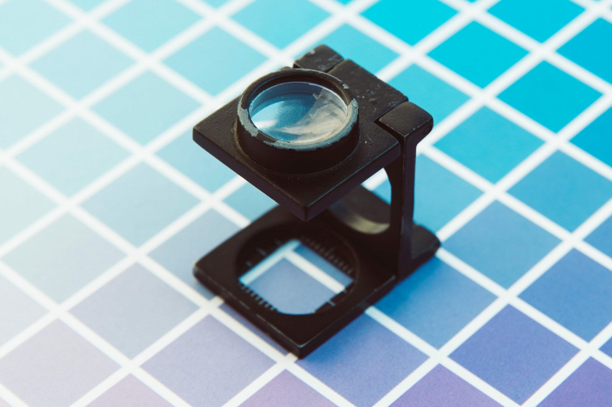 A magnifying glass checking print resolution