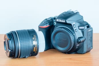 Nikon DSLR D5600 with a lens.