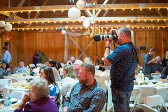 Man using a tele lens during an event.